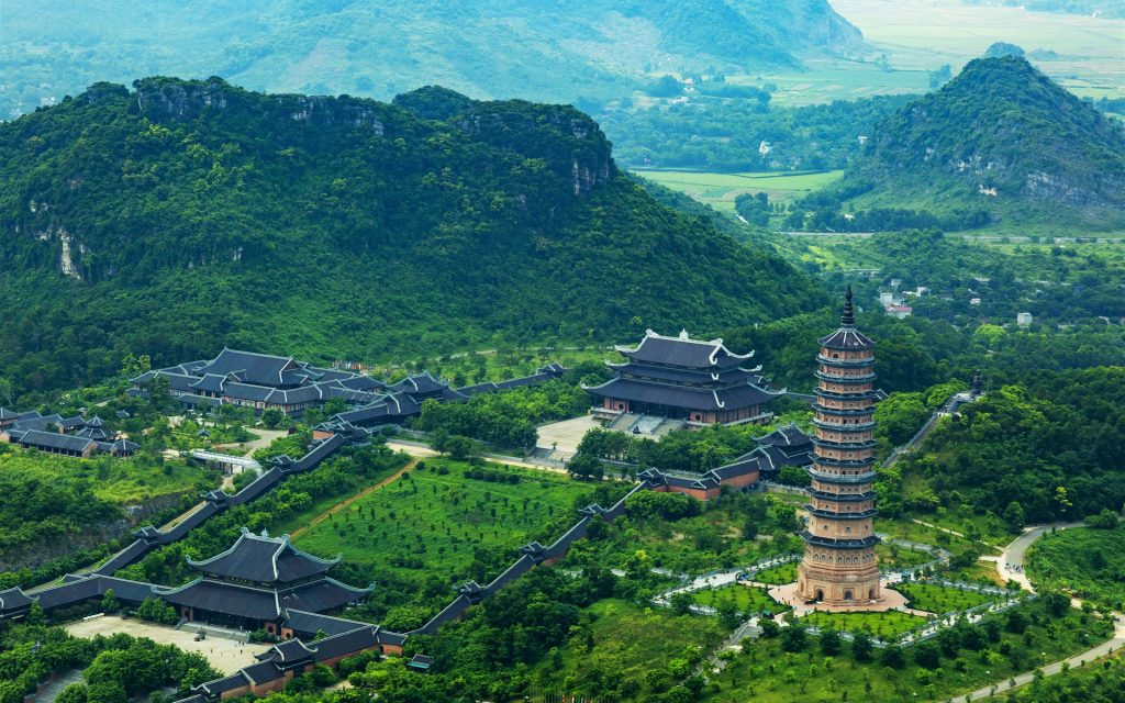 Trang-An-Vietnam-mountains-trees-tower-buildings_1920x1200